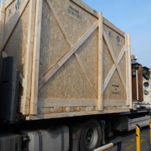 Wooden Box Made by EEEC (Europe) with Filler Carousel Loaded onto a Flat Rack